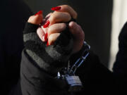 Protesters lock their hands together during a Jewish Voice for Peace rally that shut down the Henry M. Jackson Federal Building while demanding that Sen. Patty Murray, D-Wash., call for a ceasefire in the Israel-Hamas war Friday, Nov. 3, 2023, in Seattle.