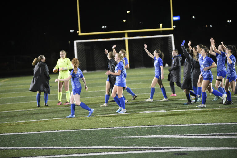 Members of the La Center girls soccer team wave to their fans after the Wildcats’ 3-2 win over Meridian of Bellingham in a Class 1A girls soccer state tournament first-round match at Woodland High School on Wednesday, Nov. 8, 2023.