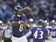 Baltimore Ravens quarterback Lamar Jackson throws during the second half of an NFL football game against the Detroit Lions, Sunday, Oct. 22, 2023, in Baltimore.