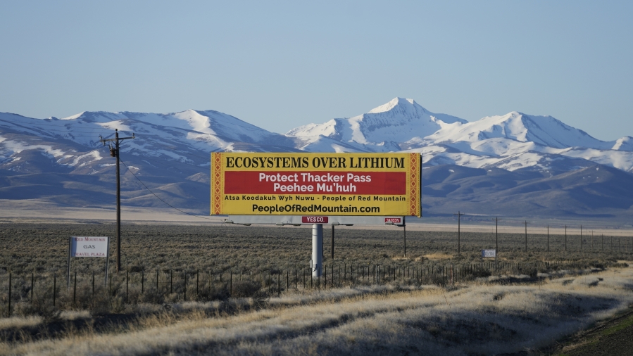 FILE - A billboard reads, &ldquo;Protect Thacker Pass,&rdquo; near the Fort McDermitt Paiute-Shoshone Indian Reservation, April 25, 2023, near McDermitt, Nev. A federal judge in Nevada has dealt another legal setback to tribes trying to halt construction of a huge lithium mine they say is near the sacred site of an 1865 massacre along the Oregon border.