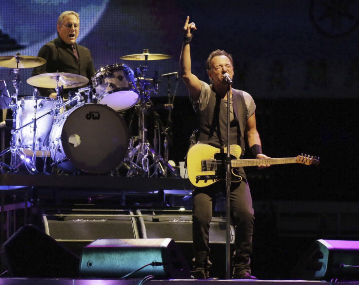FILE - Max Weinberg plays the drums, left, while Bruce Springsteen and the E Street Band perform during The River Tour on Sept. 7, 2016, in Philadelphia. Weinberg is suing the owners of a Florida car restoration company, saying they stole $125,000 by falsely promising they could deliver a like-new 1957 Mercedes-Benz he could display at top-level shows and then using his money for personal expenses.