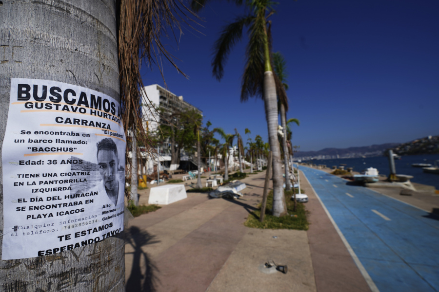 A missing persons sign hangs on a tree in Acapulco, Mexico, Sunday, Nov. 12, 2023. It was 12:20 a.m. on Oct. 25. when Hurricane Otis made landfall in this Pacific port city as a Category 5 hurricane, leaving 48 dead, mostly by drowning, and 31 missing, according to official figures. Sailors, fishermen and relatives of crew members believe that there may be more missing because sailors often go to take care of their yachts when a storm approaches.