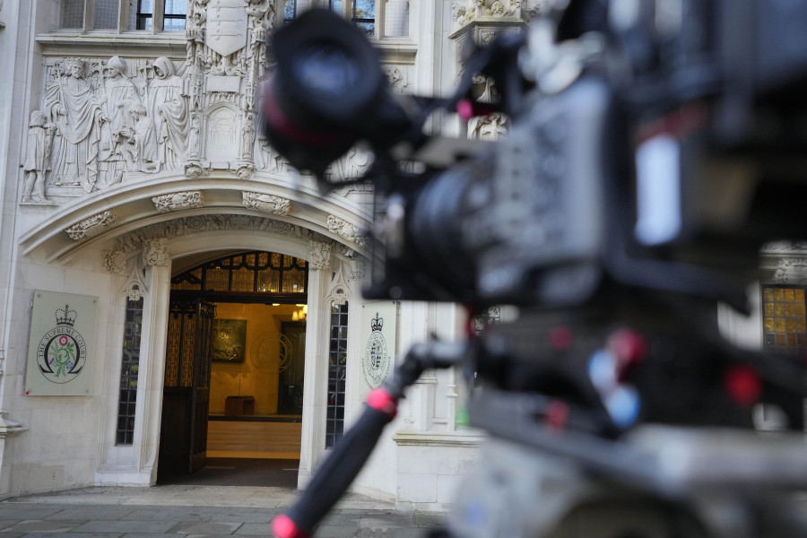 A camera focusses on the Supreme Court entrance in London, Wednesday, Nov. 15, 2023. Britain&rsquo;s highest court is set to rule Wednesday, Nov. 15 on whether the government&rsquo;s plan to send asylum-seekers to Rwanda is legal, delivering a boost or a blow to a contentious central policy of Prime Minister Rishi Sunak&rsquo;s administration. Five justices on the U.K. Supreme Court will deliver judgment in the government&rsquo;s attempt to overturn a lower court ruling that blocked deportations.