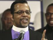 FILE - Bishop Carlton Pearson speaks at a news conference accompanied by several other clergy members, April 4, 2013, in Chicago. Bishop Carlton Pearson died Sunday, Nov. 19, 2023 in hospice care in Tulsa due to cancer according to his agent. He was 70. (AP Photo/M.