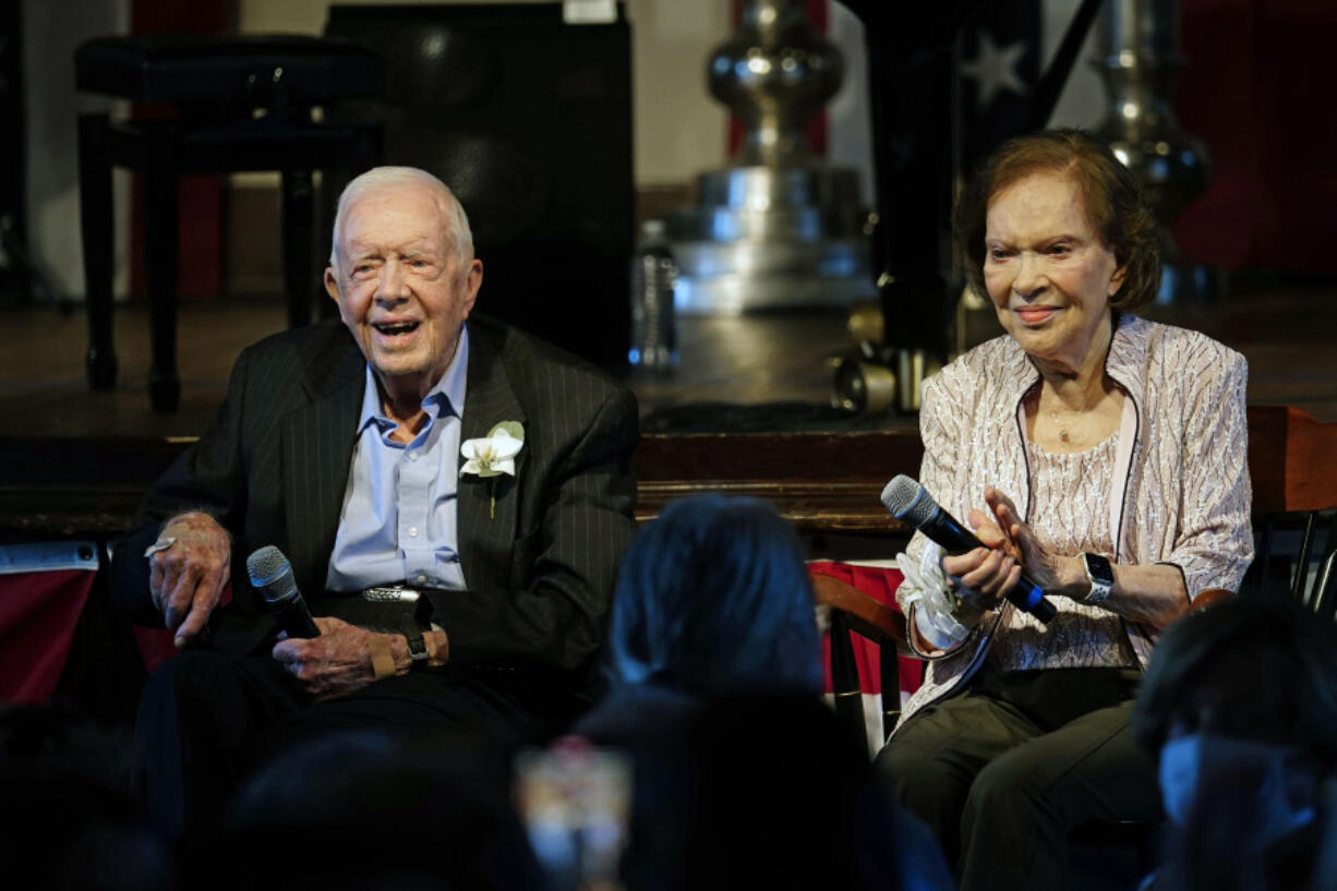 FILE - Former U.S. President Jimmy Carter and his wife, former first lady Rosalynn Carter, sit together during a reception to celebrate their 75th wedding anniversary, July 10, 2021, in Plains, Ga. Rosalynn Carter, the closest adviser to Jimmy Carter during his one term as U.S. president and their four decades thereafter as global humanitarians, died Sunday, Nov. 19, 2023. She was 96.