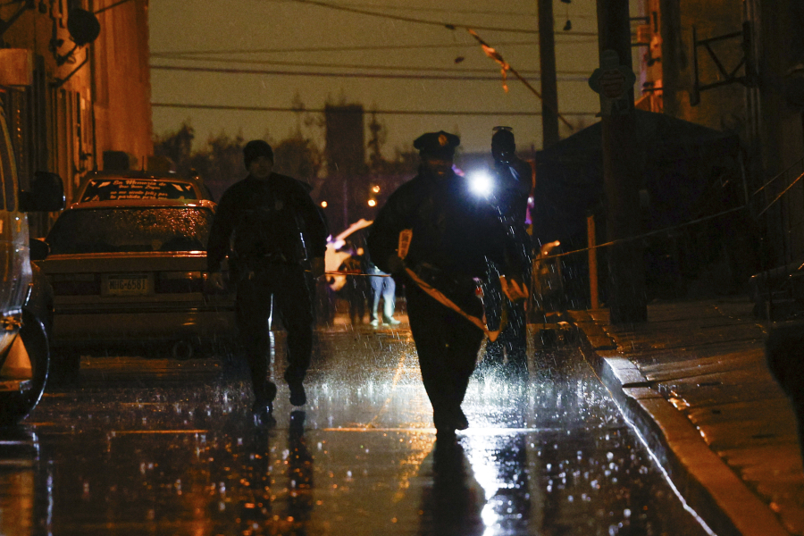 Police and crime scene investigators respond to multiple people shot at  in Philadelphia, on Tuesday, Nov. 21, 2023.  Police investigation into the shooting of seven men, including two who died, continued Wednesday but authorities said no arrests have been made. (Steven M.