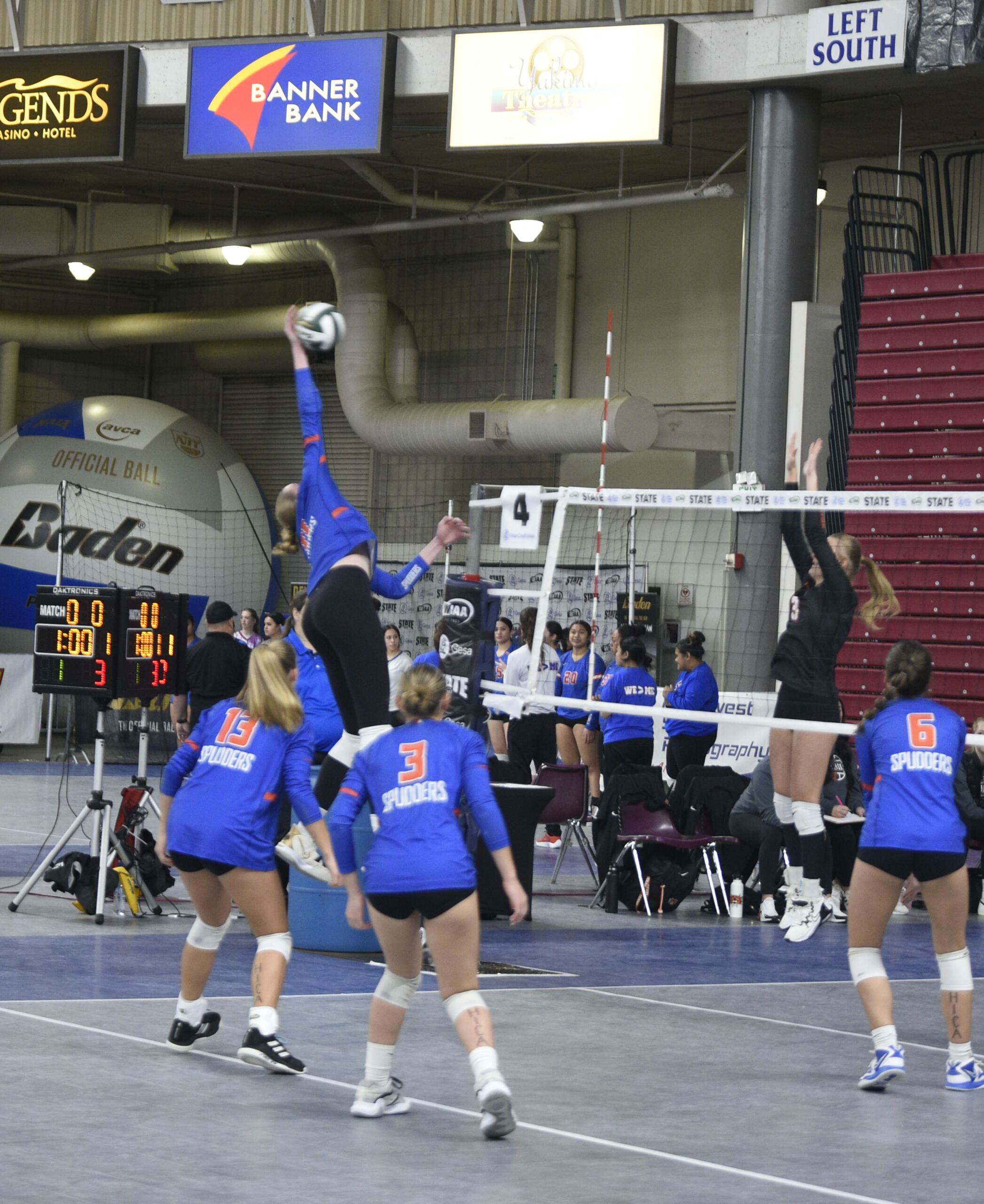 Ridgefield's Lizzy Andrew hits a spike during a first-round match in the Class 2A state volleyball tournament against Ephrata on Friday, Nov. 10, 2023 in Yakima. The 6-foot-5 senior has committed to play at Stanford.