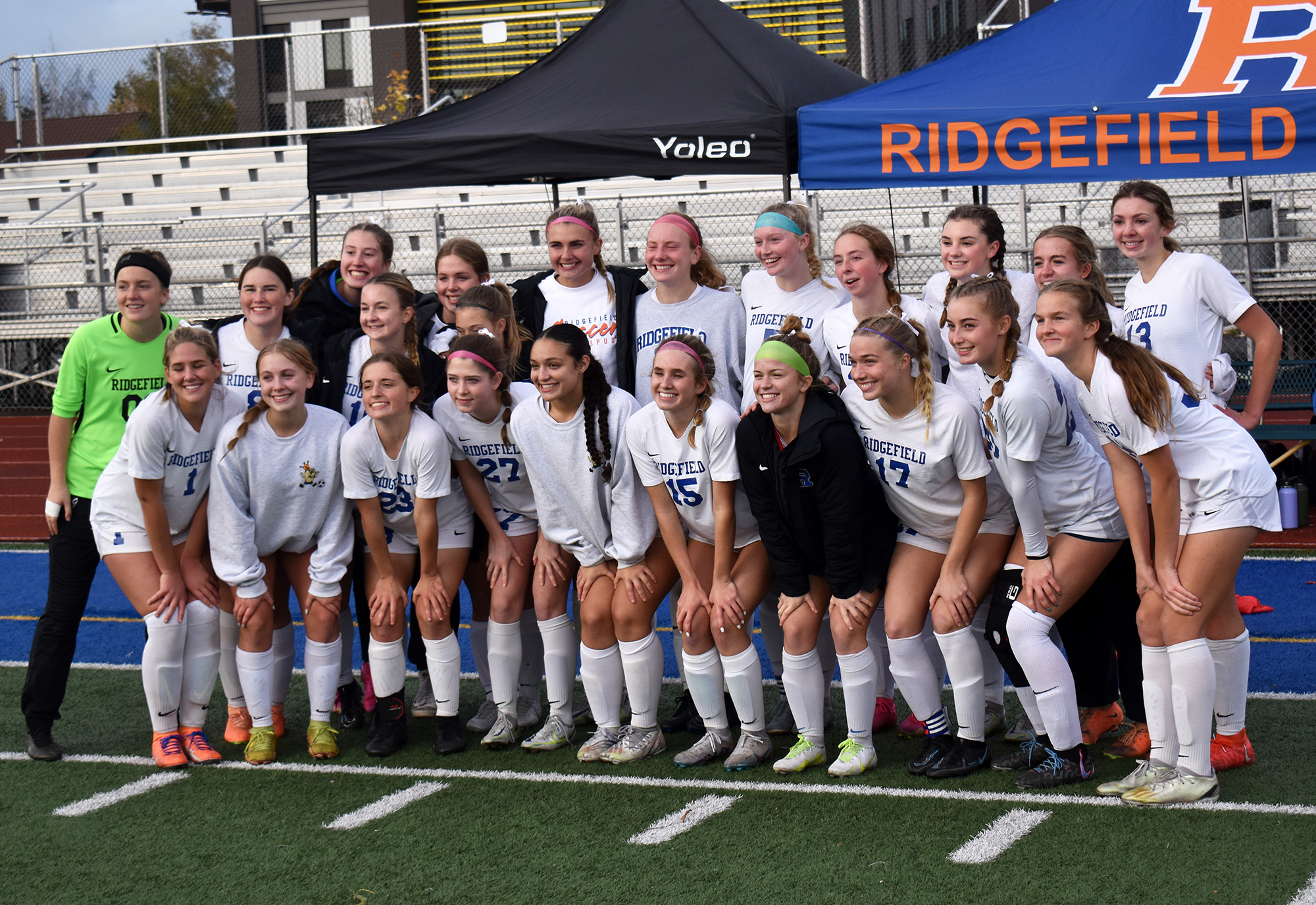 The Ridgefield girls soccer team poses for a team photo after a 2-1 win over Fife on penalty kicks in the Class 2A state quarterfinal match at Fife High School on Saturday, Nov. 11, 2023.