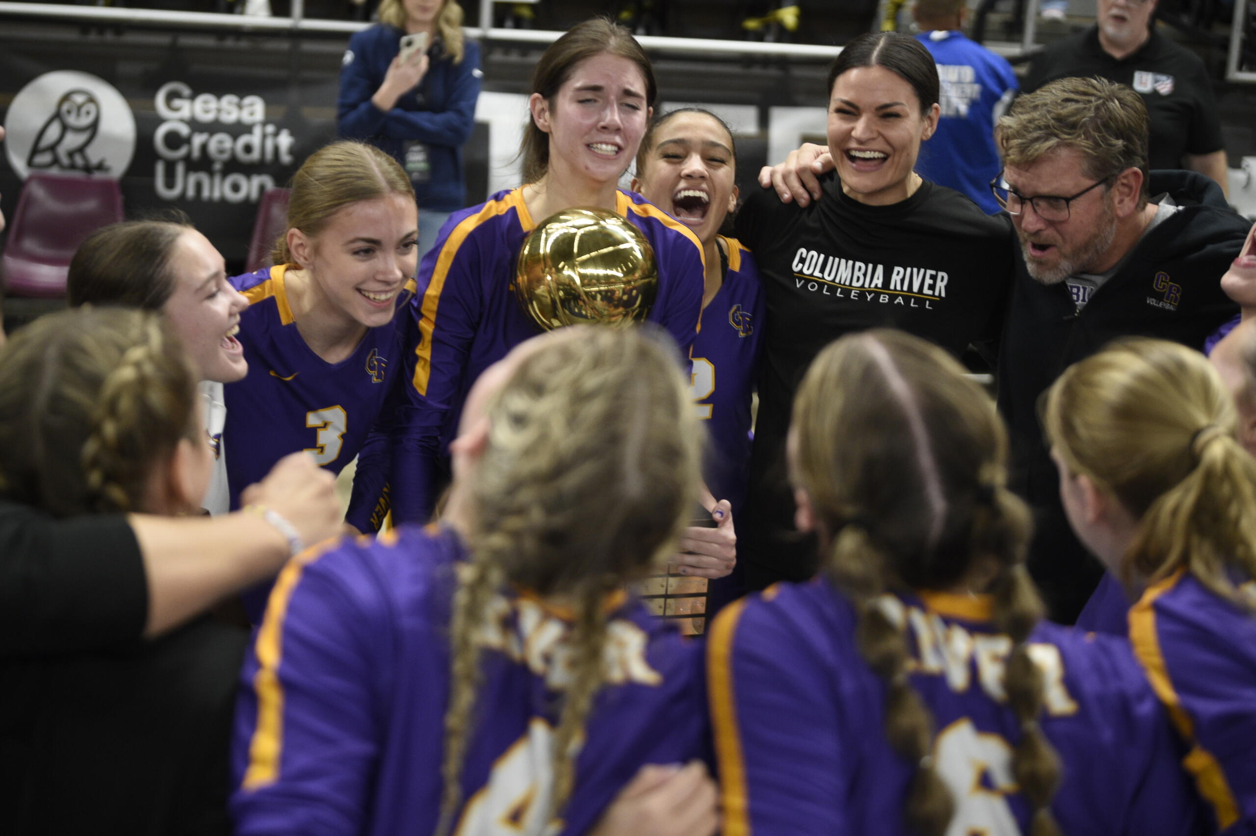 Columbia River's Lauren Dreves holds the Class 2A volleyball state championship trophy after the title match against Ridgefield on Saturday, Nov, 11, 2023 in Yakima.