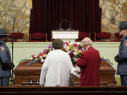 Mourners pause at the casket before the funeral service for former first lady Rosalynn Carter at Maranatha Baptist Church, Wednesday, Nov. 29, 2023, in Plains, Ga. The former first lady died on Nov. 19. She was 96.