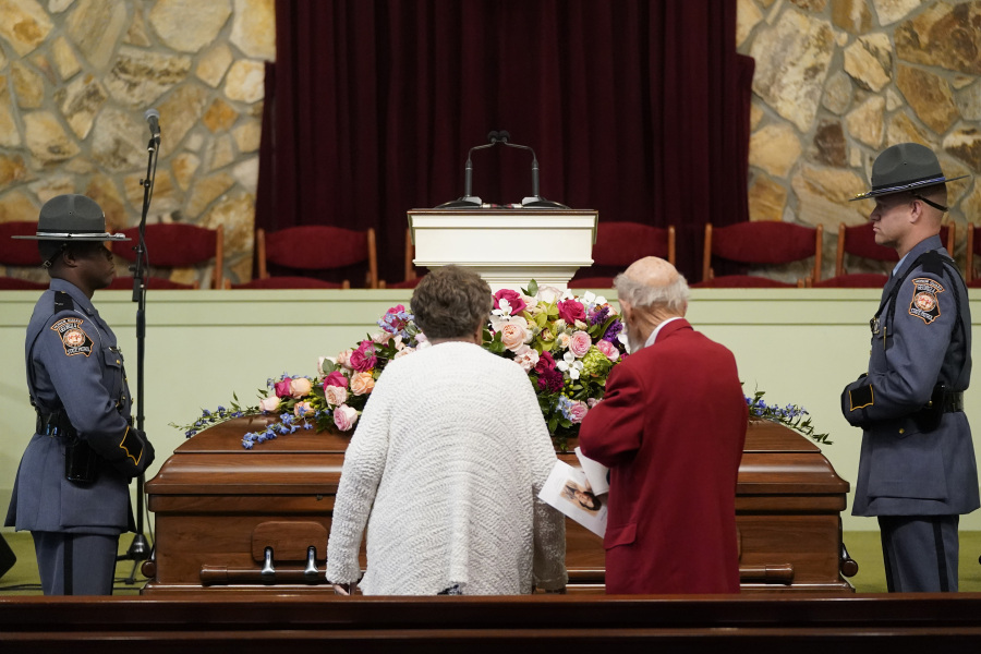 Mourners pause at the casket before the funeral service for former first lady Rosalynn Carter at Maranatha Baptist Church, Wednesday, Nov. 29, 2023, in Plains, Ga. The former first lady died on Nov. 19. She was 96.