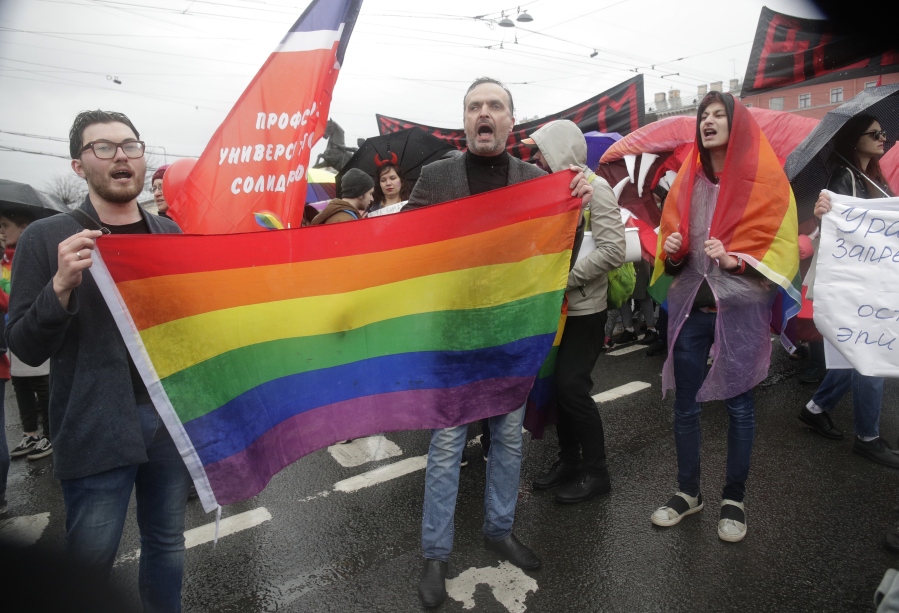 FILE - Advocate and founder of the Russian LGBT Network rights group Igor Kochetkov, center, and other activists attend a May Day rally in St. Petersburg, Russia, Tuesday, May 1, 2018. Russia&rsquo;s Supreme Court on Thursday, Nov. 30, 2023, effectively outlawed LGBTQ+ activism, in the most drastic step against advocates of gay, lesbian and transgender rights in the increasingly conservative country.