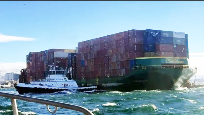 Tugs recovered the barge after it made contact on the Seattle waterfront (USCG)