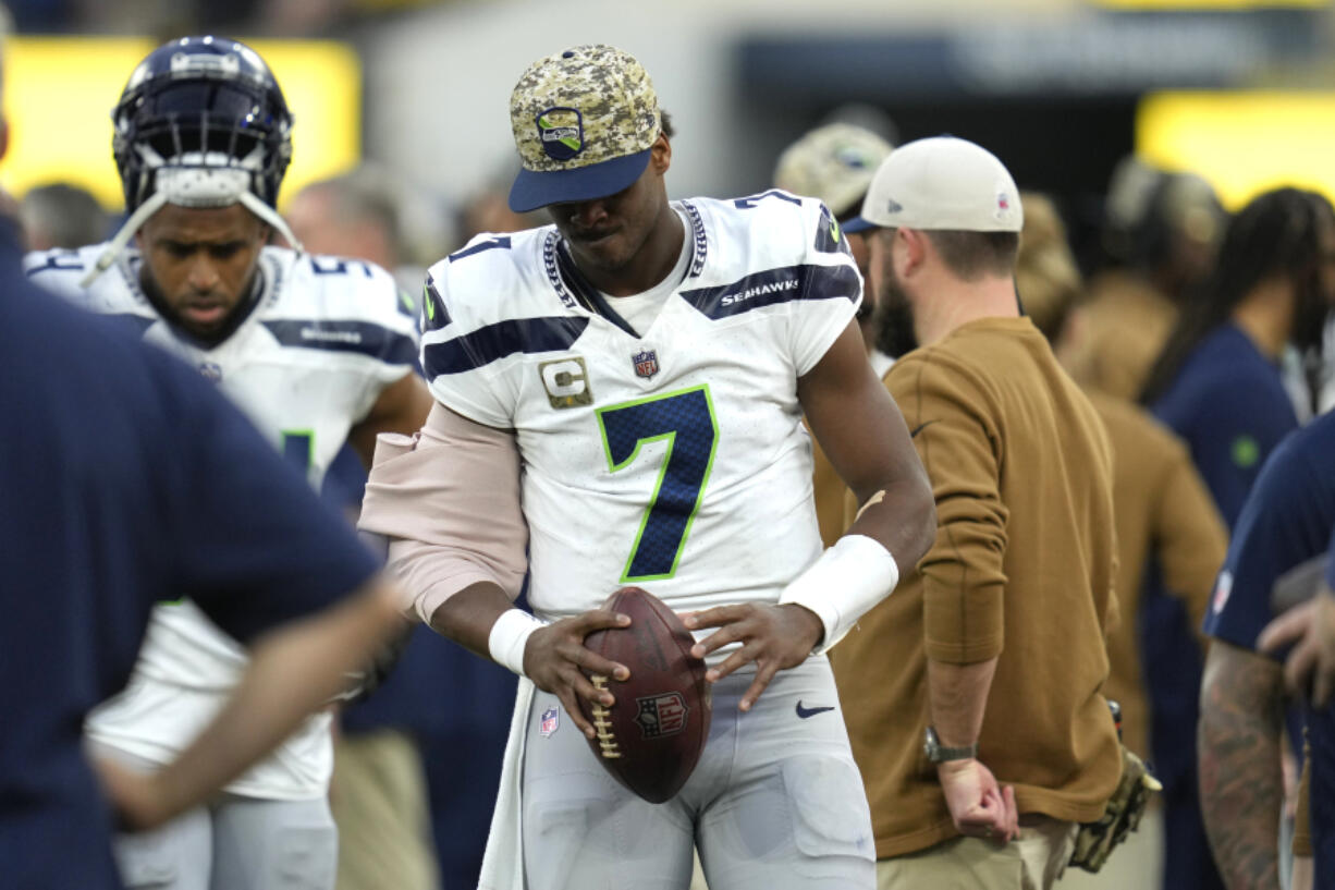 Seattle Seahawks quarterback Geno Smith (7) stands on the sideline after leaving the game due to injury during the second half of an NFL football game against the Los Angeles Rams Sunday, Nov. 19, 2023, in Inglewood, Calif.