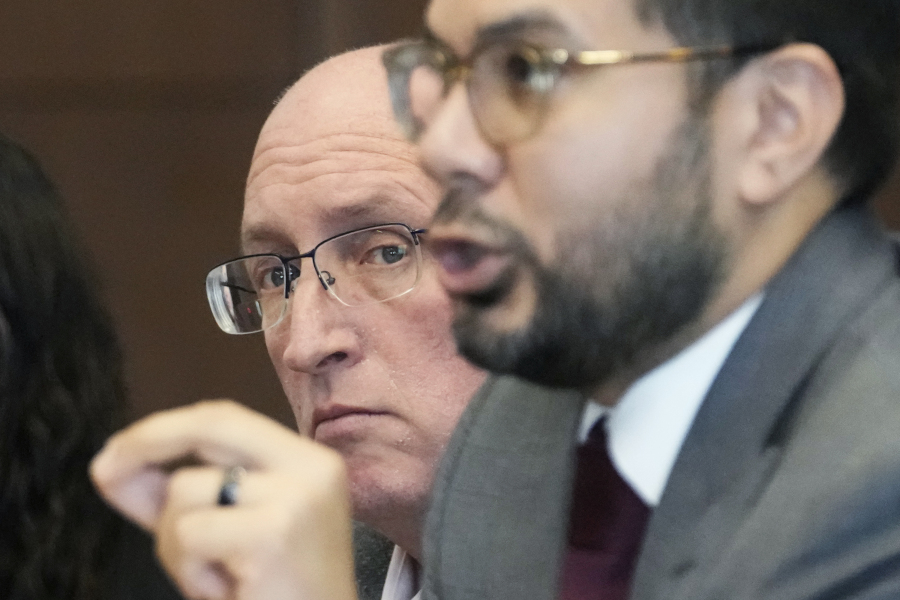 Robert E. Crimo Jr., left, listens to his attorney George Gomez while he speaks to Judge George D. Strickland during an appearance at the Lake County Courthouse, Friday, Nov. 3, 2023, in Waukegan, Ill. A judge expected to hold a final pretrial hearing for the Illinois man accused of helping his son obtain a gun license three years before the younger man fatally shot seven people at a 2022 Fourth of July parade in suburban Chicago. (AP Photo/Nam Y.