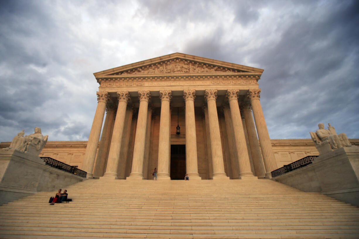FILE - The U.S. Supreme Court is seen at near sunset in Washington, on Oct. 18, 2018. The Supreme Court is hearing arguments in a challenge to the Securities and Exchange Commission&rsquo;s ability to fight fraud, part of a broader attack on regulatory agencies led by conservative and business interests.