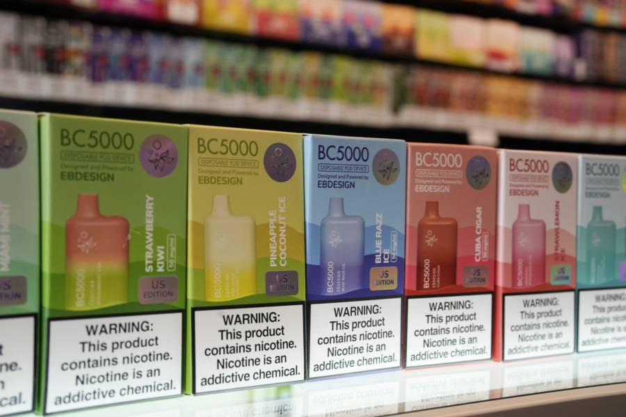 FILE - Varieties of disposable flavored electronic cigarette devices manufactured by EB Design, formerly known as Elf Bar, are displayed at a store in Pinecrest, Fla., Monday, June 26, 2023. A report released by the Centers for Disease Control and Prevention on Thursday, Nov. 2, 2023, shows fewer high school students are vaping. About 10% of high school students said they used electronic cigarettes in the previous month, down from 14% from the same survey conducted last year. Fewer high schools students also smoked cigarettes and cigars. The use of e-cigarettes among middle school students was about the same as last year.