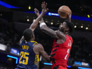 Portland Trail Blazers center Deandre Ayton (2) shoots over Indiana Pacers forward Jalen Smith (25) during the first half of an NBA basketball game in Indianapolis, Monday, Nov. 27, 2023.