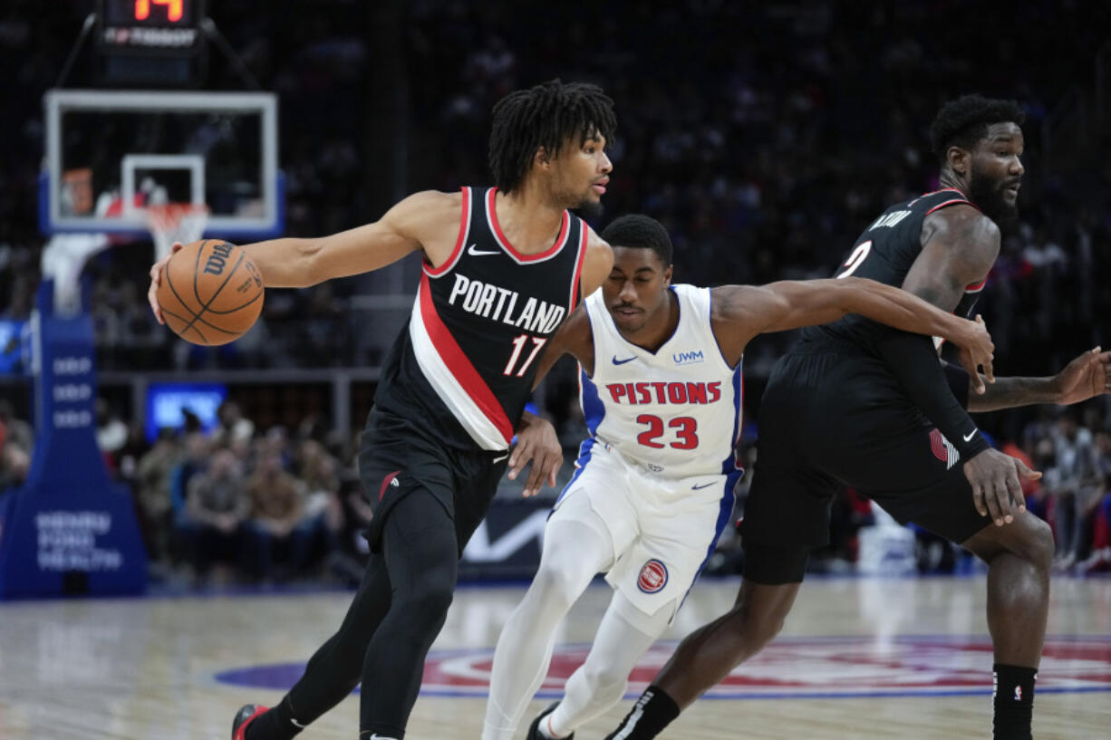 Portland Trail Blazers guard Shaedon Sharpe (17) drives on Detroit Pistons guard Jaden Ivey (23) in the first half of an NBA basketball game in Detroit, Wednesday, Nov. 1, 2023.