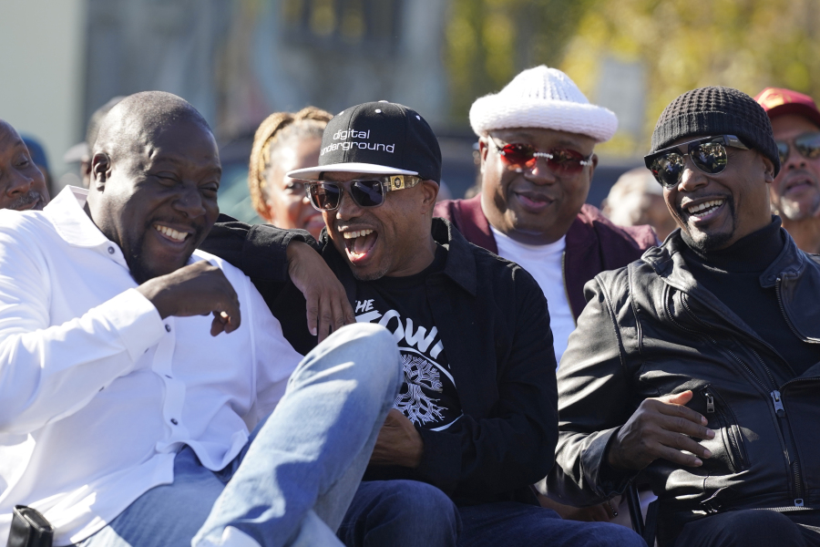 From left, Ray Luv, Money-B, E-40 and MC Hammer laugh during a street renaming ceremony Nov. 3 for Tupac Shakur in Oakland, Calif.