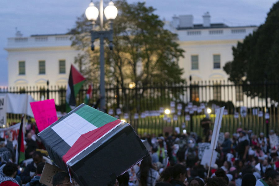 Anti-war activists carrying a mock coffin protest outside of the White House during a pro-Palestinian demonstration asking for a cease fire in Gaza in Washington, Saturday, Nov. 4, 2023.