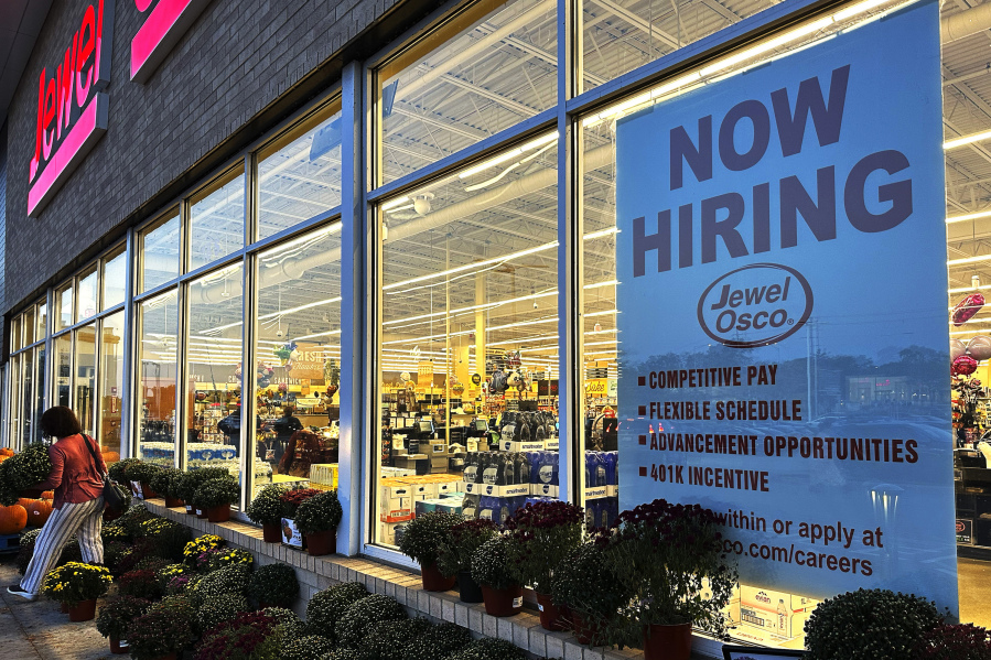 A hiring sign is displayed at a grocery store in Deerfield, Ill., Thursday, Oct. 5, 2023. On Wednesday, the Labor Department reports on the number of people who applied for unemployment benefits last week. (AP Photo/Nam Y.