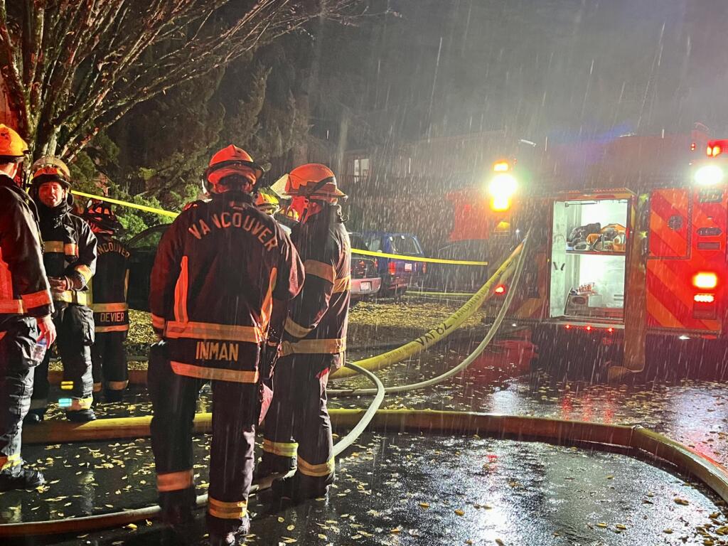 Vancouver firefighters await reassignment after knocking down a fire at the Nobl Park Apartments in Orchards on Saturday night.