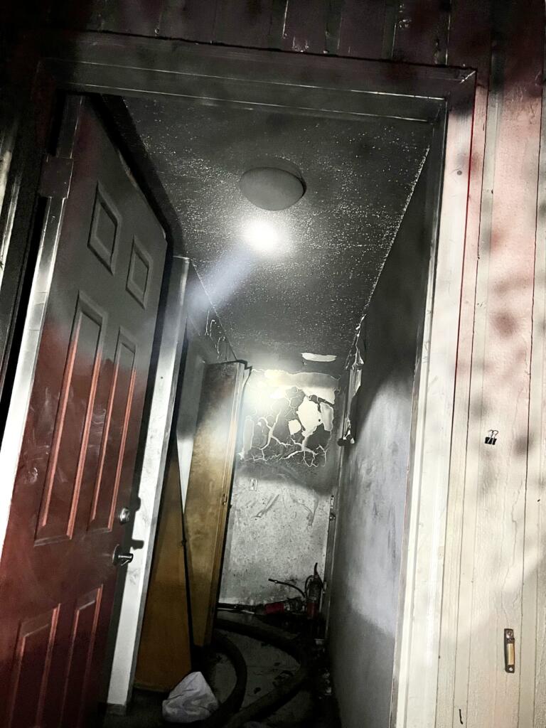A view looking into the front door of a unit at the Nobl Park Apartments shows some of the damage.