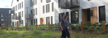 Adam Fractor and Chelsea Rooklyn, employees for Portland-based Killian Pacific walk through Eagle View Park between Ninebark apartments and the Columbia River in Washougal.