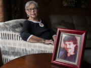 Sharol Lucey, a 76-year-old Vancouver resident, is among the longest-living heart transplant patients in the region. She sits near a picture of her heart donor, Steven Haugen, who died in 1997, making her life possible.