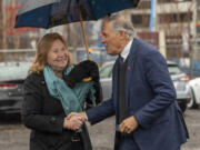 Vancouver Mayor Anne McEnerny-Ogle, left, greets Washington Gov. Jay Inslee on Thursday, Nov. 30, 2023, at the Vancouver Waterfront. Inslee was in town to talk about the state&Ccedil;&fnof;&Ugrave;s commitment to replacing the aging Interstate 5 bridge.