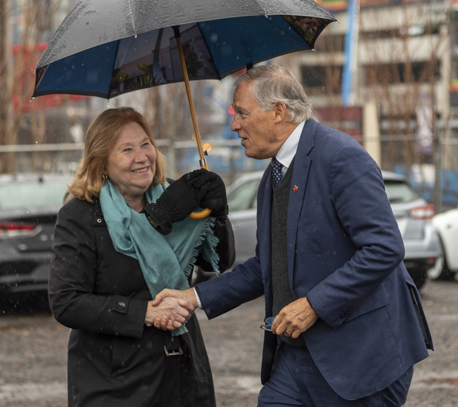 Vancouver Mayor Anne McEnerny-Ogle, left, greets Washington Gov. Jay Inslee on Thursday, Nov. 30, 2023, at the Vancouver Waterfront. Inslee was in town to talk about the state&Ccedil;&fnof;&Ugrave;s commitment to replacing the aging Interstate 5 bridge.