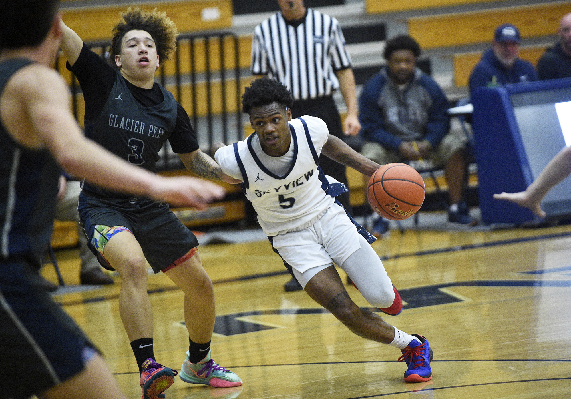 Skyview's Demaree Collins (5) drives to the basket during the Storm's game against Glacier Peak at Skyview High School on Saturday, Dec. 2, 2023.