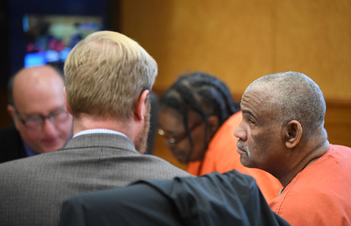 Jesse Franks, right, and Felicia Adams, center, talk to defense attorneys Alyosha McClain and Jeff Sowder, respectively, on Wednesday during their sentencing at the Clark County Courthouse. The pair were found guilty of homicide by abuse and second-degree murder in the 2020 starvation death of their adopted 15-year-old son, Karreon Franks, after a two-week trial in October.