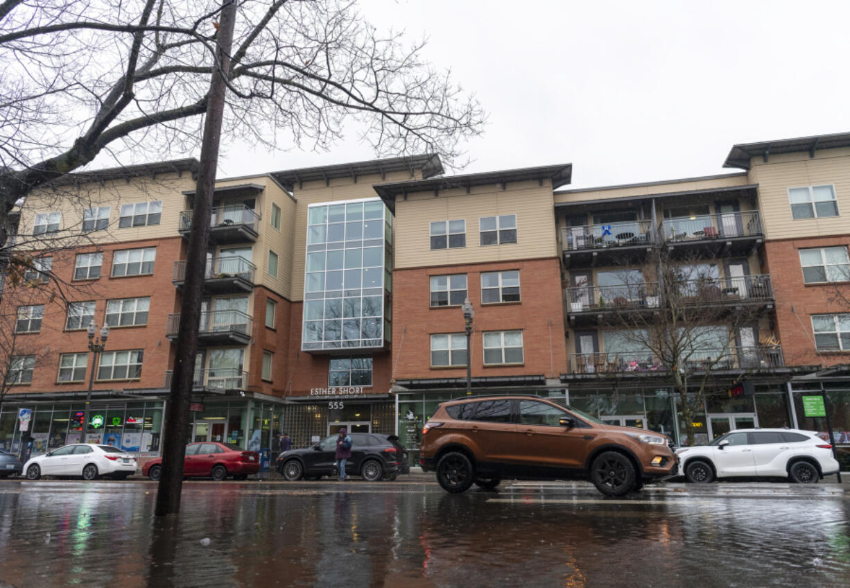 Rain falls over the Esther Short Commons apartment building in Vancouver. The building will receive a new roof, flooring and more.