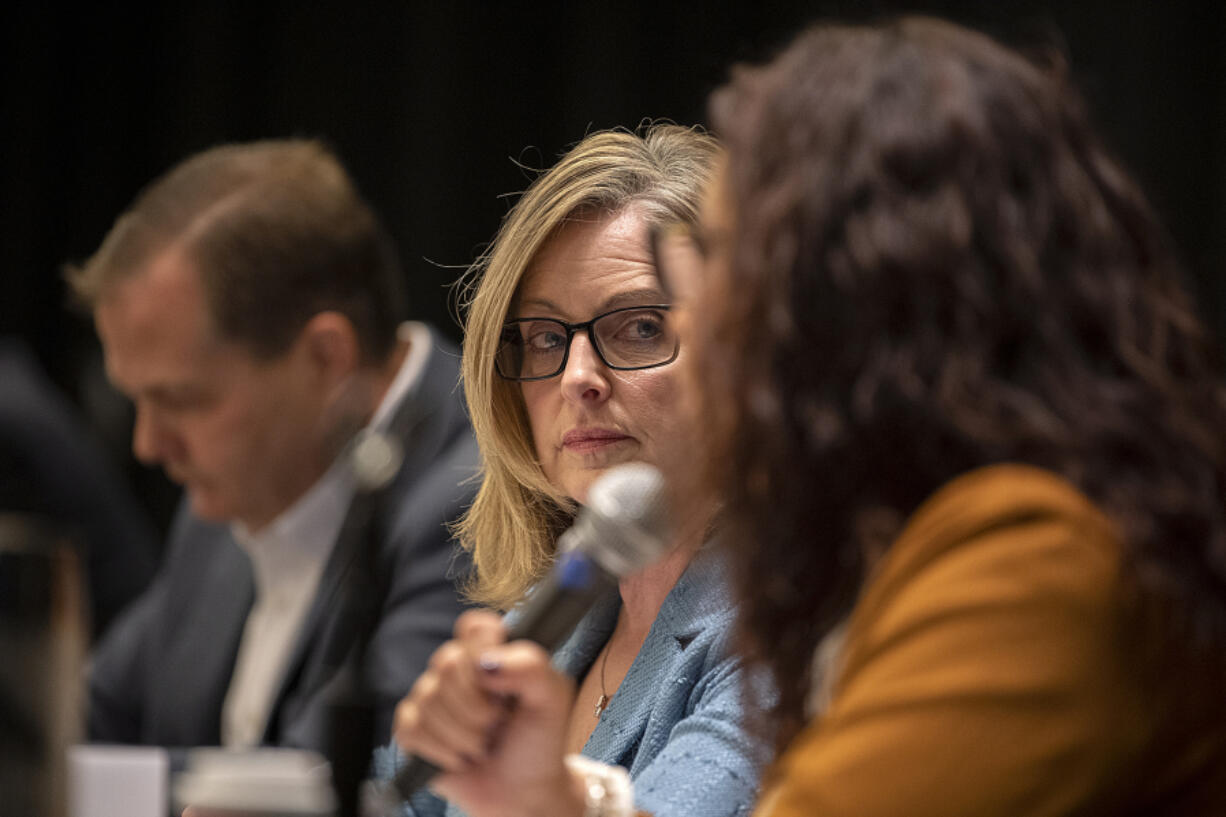 Sen. Annette Cleveland, D-Vancouver, center, listens as Rep. Monica Stonier, D-Vancouver, right, speaks to the crowd during the 2024 Legislature Outlook at the Hilton Vancouver Washington on Friday morning.