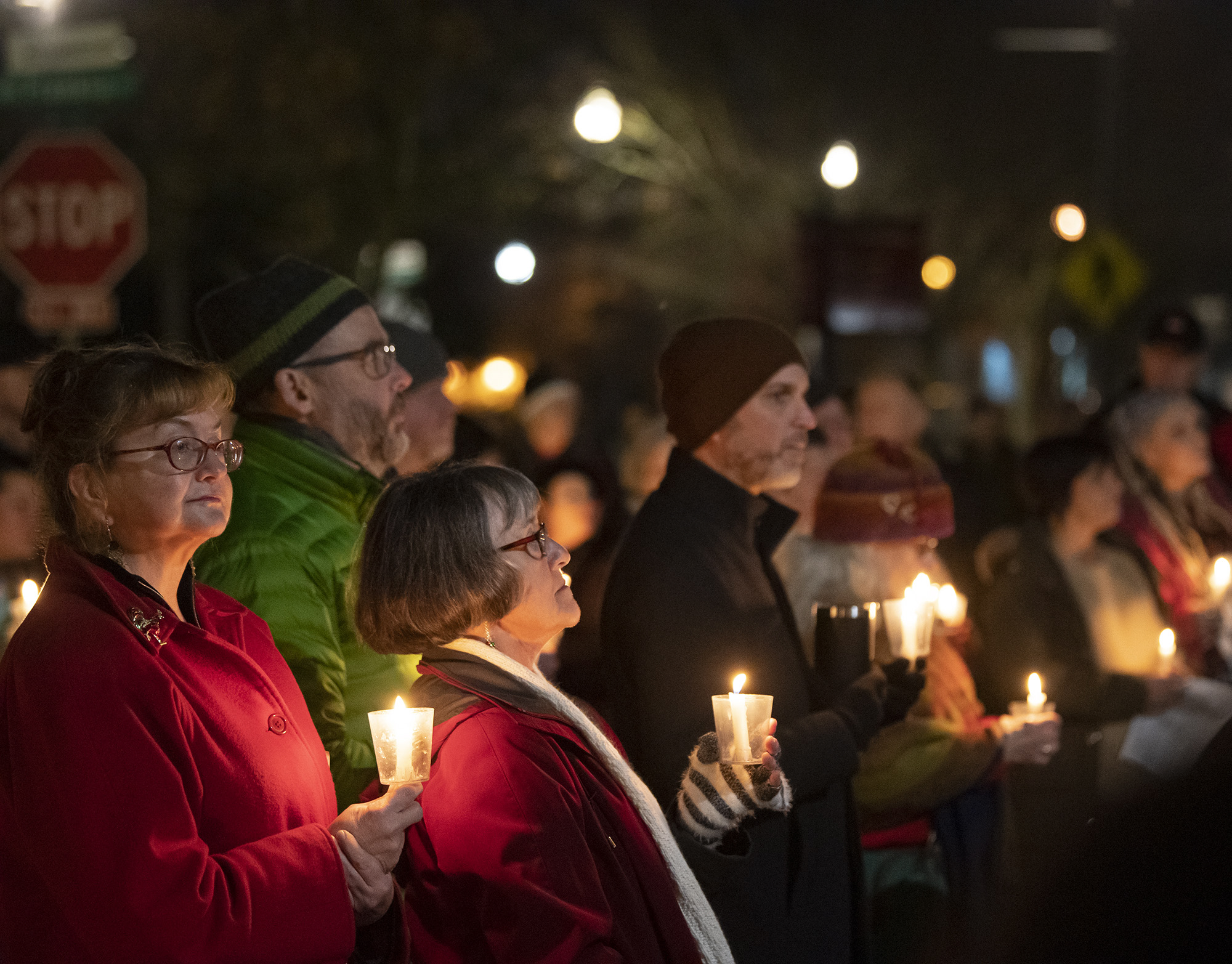 Attendees hold candles Friday, Dec. 21, 2023, during a Homeless Persons Memorial Day event at St. Paul Lutheran Church in downtown Vancouver.