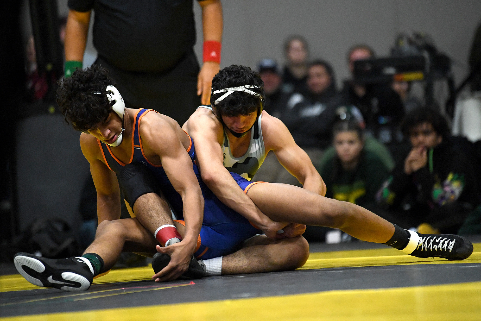 Union senior Armando Nicacio, right, wrestles with Graham-Kapowsin senior Devan Carter on Friday, Dec. 22, 2023, during the Pac Coast Wrestling Championships at the Clark County Event Center in Ridgefield. Carter won the 165-pound bout by decision, 5-0.