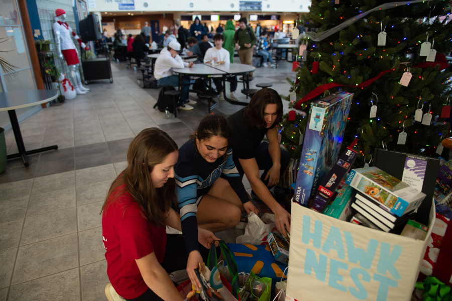 Hockinson senior Sophia Sermone, 18, middle, consolidates toy donations meant for Doernbecher Children&rsquo;s Hospital in Portland. Classmates Zachary Chung, right, and Sarah Deroos, left, both 17 and juniors, helped with donations.
