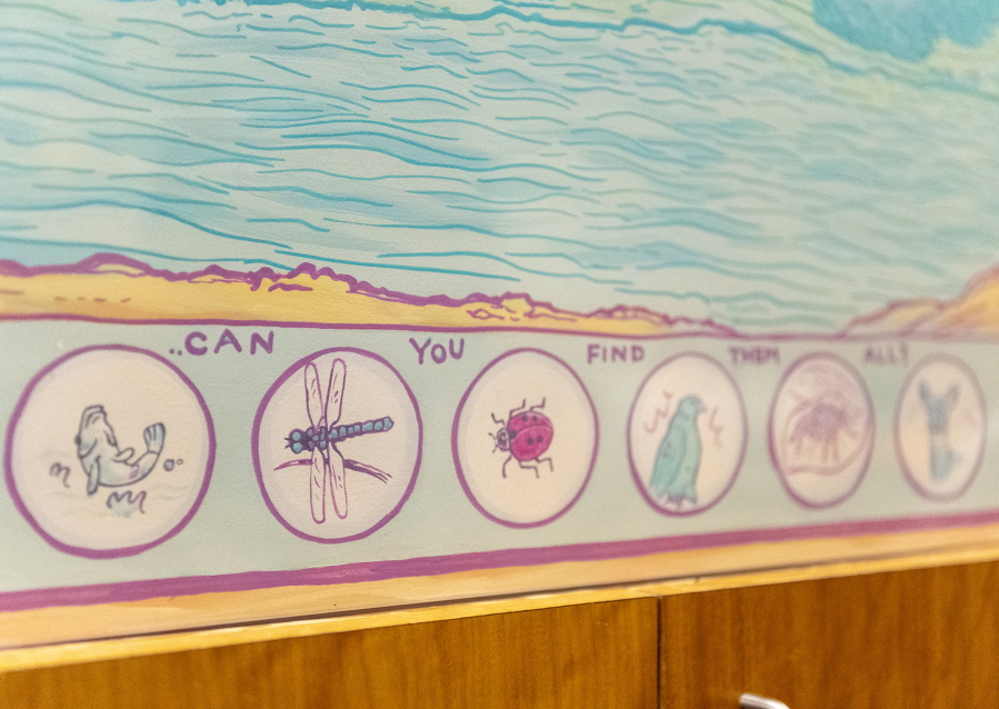 A mural by Portland-based artist John Vance encourages waiting room visitors to find bugs, fish and other animals at Legacy Salmon Creek Medical Center.
