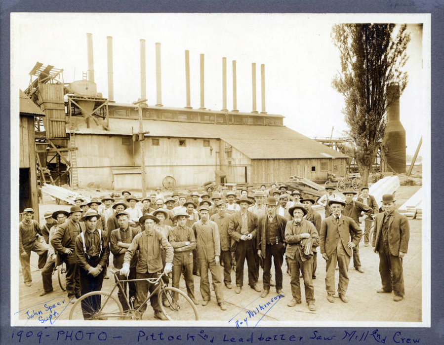 Some of the Pittock &amp; Leadbetter Lumber Company crew pose for a photo outside the Vancouver sawmill in Vancouver. The original plant burned in June 1908 but reopened in October. The mill was owned by Clark County lumberman Frederick Leadbetter and his father-in-law, Henry Pittock.