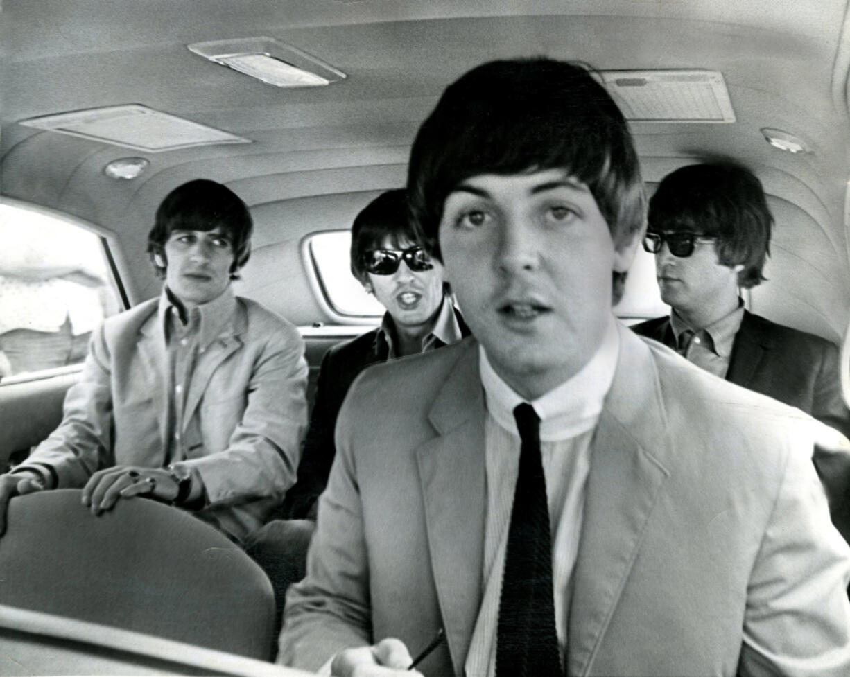 The Beatles get ready to leave Denver&rsquo;s Stapleton Field after their afternoon arrival on Aug. 26, 1964. The famed British rock group was scheduled to appear at Red Rocks Amphitheatre. In the foreground is Paul McCartney. In the rear, from the left, are Ringo Starr, George Harrison and John Lennon.