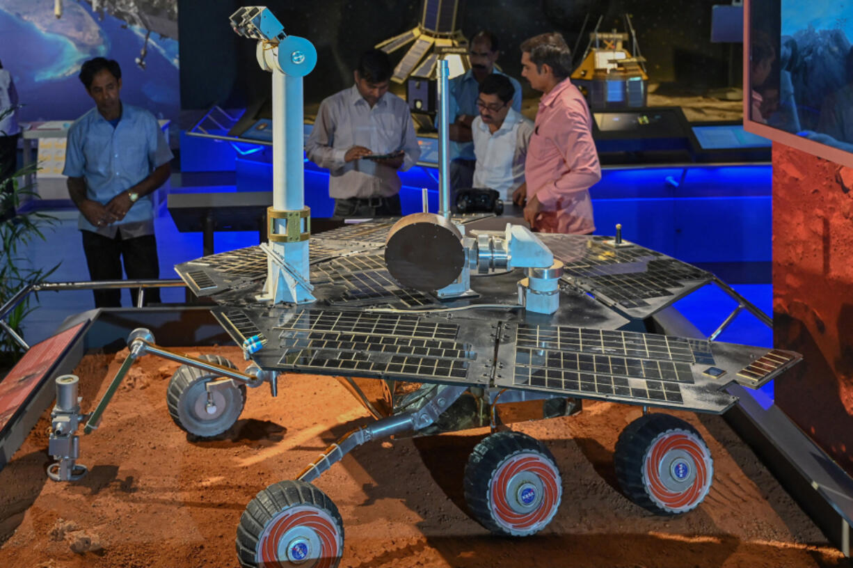 Visitors look at a replica of NASA&rsquo;s Mars Rover Opportunity during its unveiling ceremony at the Visvesvaraya Industrial and Technological Museum in Bengaluru on June 1, 2023.