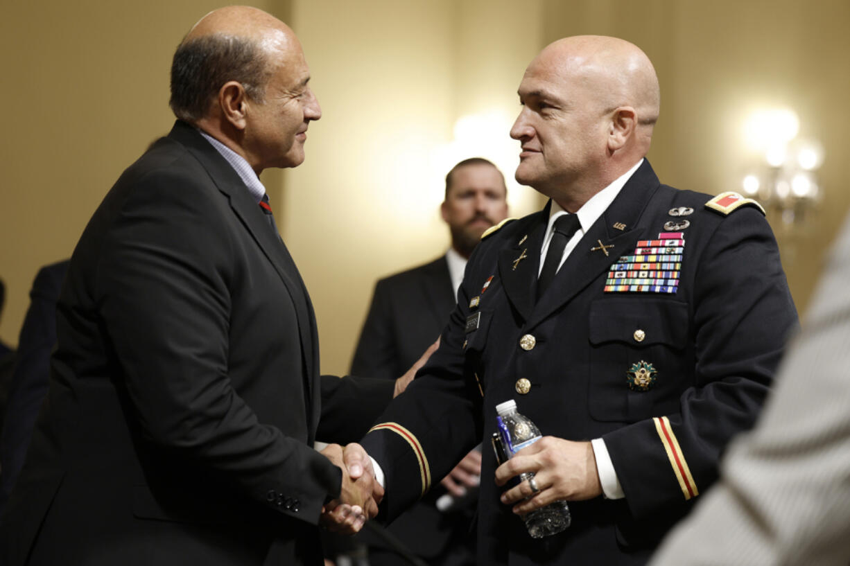 Ranking Member Lou Correa (D-CA) shakes hands with Colonel Jason Jefferis, the head of contracting activities with the U.S. Army Corps of Engineers, during a joint Homeland Security subcommittee hearing on Capitol Hill on July 18, 2023, in Washington, DC. Members of the subcommittee on Border Security and Enforcement and Oversight, Investigations, and Accountability held the hearing to discuss the halting of building the wall along the southern border.