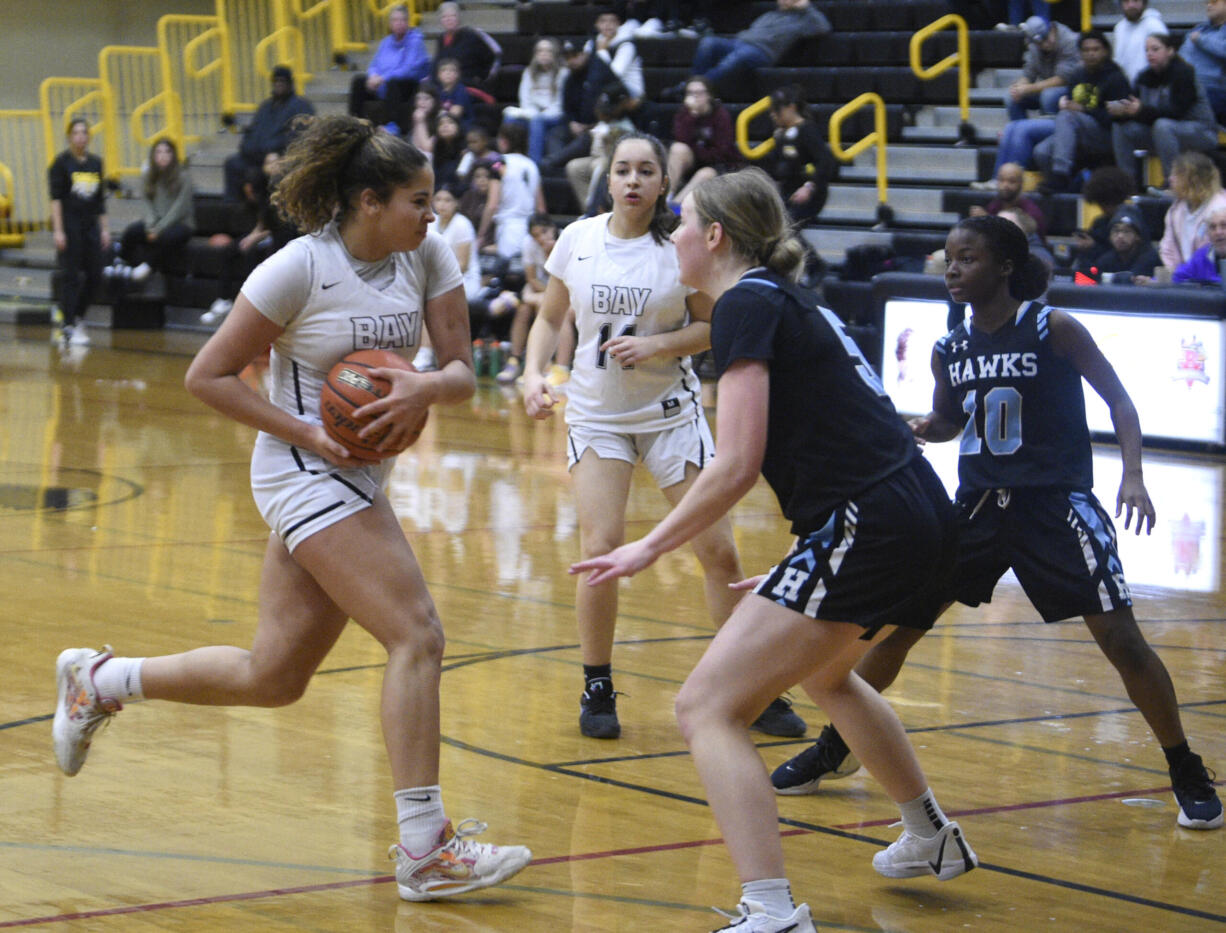 Hudson’s Bay’s Alana Stephens drives into the paint against Hockinson’s Siena Brown during a 2A Greater St. Helens League girls basketball game on Friday, Dec. 8, 2023, at Hudson’s Bay High School.