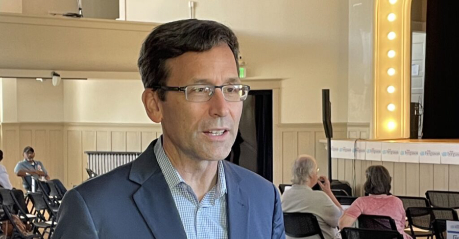Attorney General Bob Ferguson speaks to a reporter as his 2024 gubernatorial campaign launch event gets underway in Seattle, on Saturday, Sept. 9, 2023.
