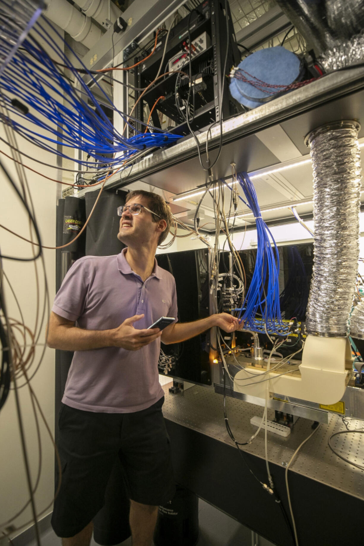 Marko Cetina, Duke assistant professor of Physics, works in the lab at the Duke Quantum Center on Aug. 30, 2022, in Durham, North Carolina. His research is focused on increasing complex quantum algorithms with increased numbers of quantum bits.