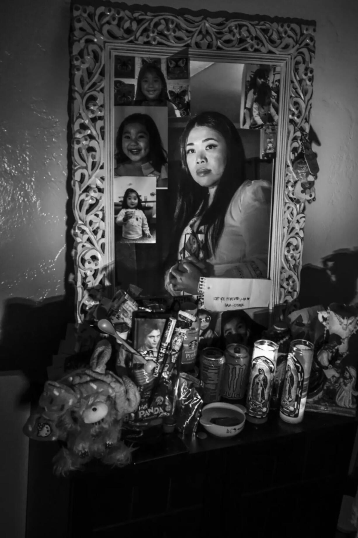 Jeramie Naya Vives Osorio&Ccedil;&fnof;&Ugrave;s mother gazes into a mirror above her altar. Her daughter died in March, just eight weeks shy of her 17th birthday.
