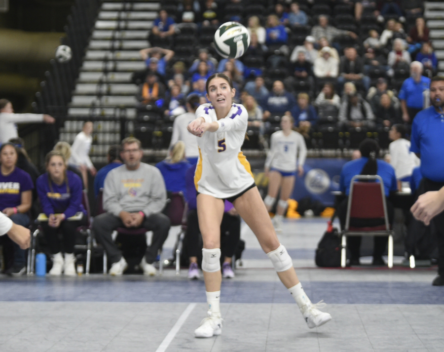Columbia River&iacute;s Lauren Dreves (5) makes a dig during the Class 2A volleyball state semifinals match against Burlington-Edison on Saturday, Nov.