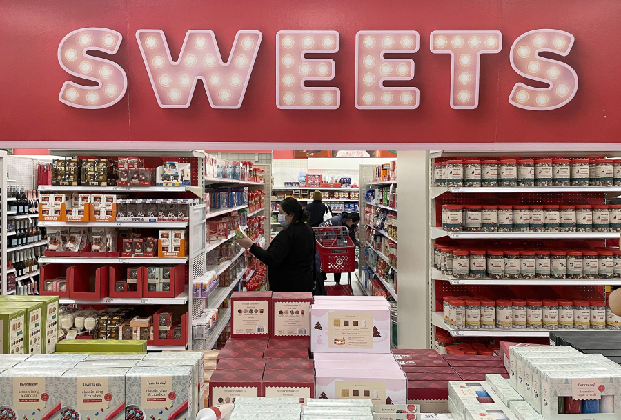 Customers shop for holiday candy at a Target store on Dec. 14, 2023, in Daly City, California.